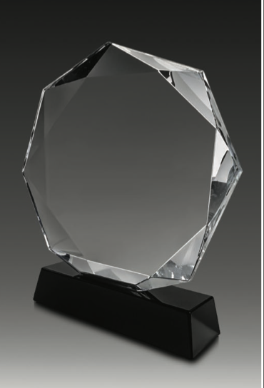 A uniquely shaped Nonaglow crystal piece resting on a soft-edged black base, Obsidian Crest blends balance with boldness. Its refined geometry and smooth contours evoke modern architectural elegance, while the deep onyx base adds a commanding presence. A perfect choice for recognition or refined display.