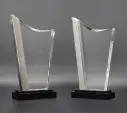 The Transparis trophy features a sleek, clear front crystal body framed by metallic rock grey sides that add a modern touch. with a glossy black base,  enhances its contemporary look, Great for achievements.
