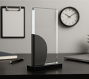 The Metaluxe trophy is a transparent vertical trophy with a sleek design, placed on a black base  Its elegant form makes it an ideal choice for awards and recognition events. It comes packaged in a gift box, perfect choice for awards, recognition, and moments that matter.