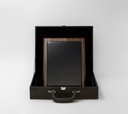 The Timberlay plaque features a sleek black panel framed by rich, dark wood, offering a timeless and professional appearance