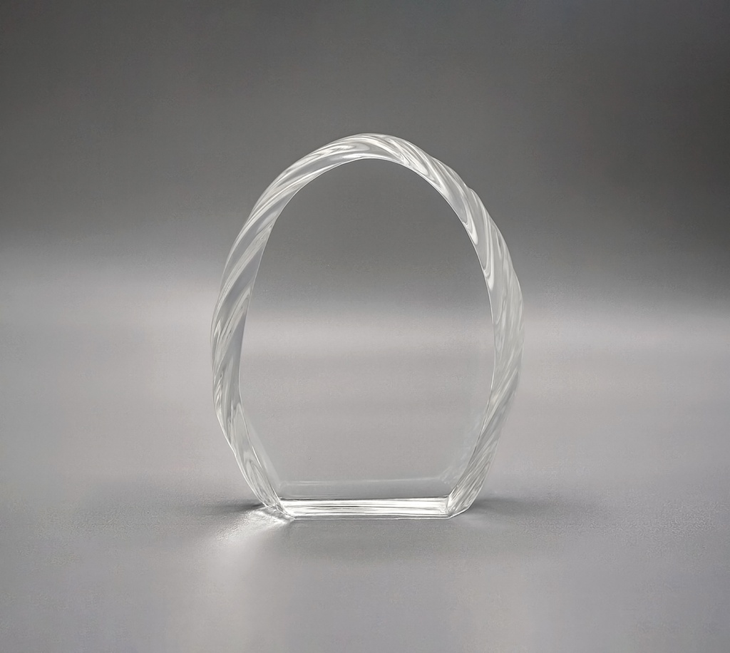 The Petaluxe crystal award features a curved shape, made from high-quality, lead-free K9 crystal. Its textured, frosted edges create a striking contrast with the clear central surface, enhancing its visual appeal. With customization options and multiple sizes, this award is perfect for achievements in style and elegance.